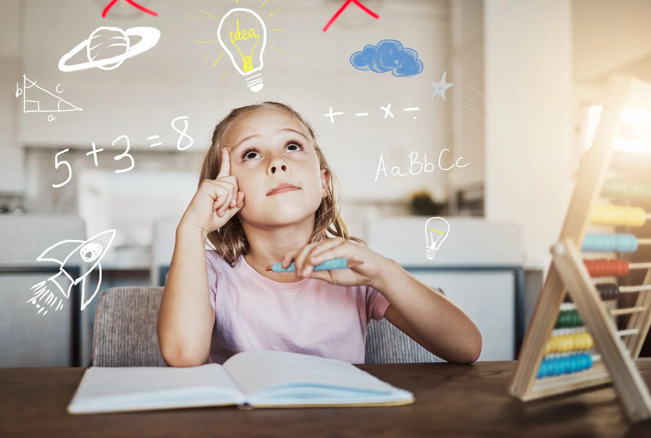 Young girl sitting at a desk studying while imaginative drawings of school subjects surround her head.