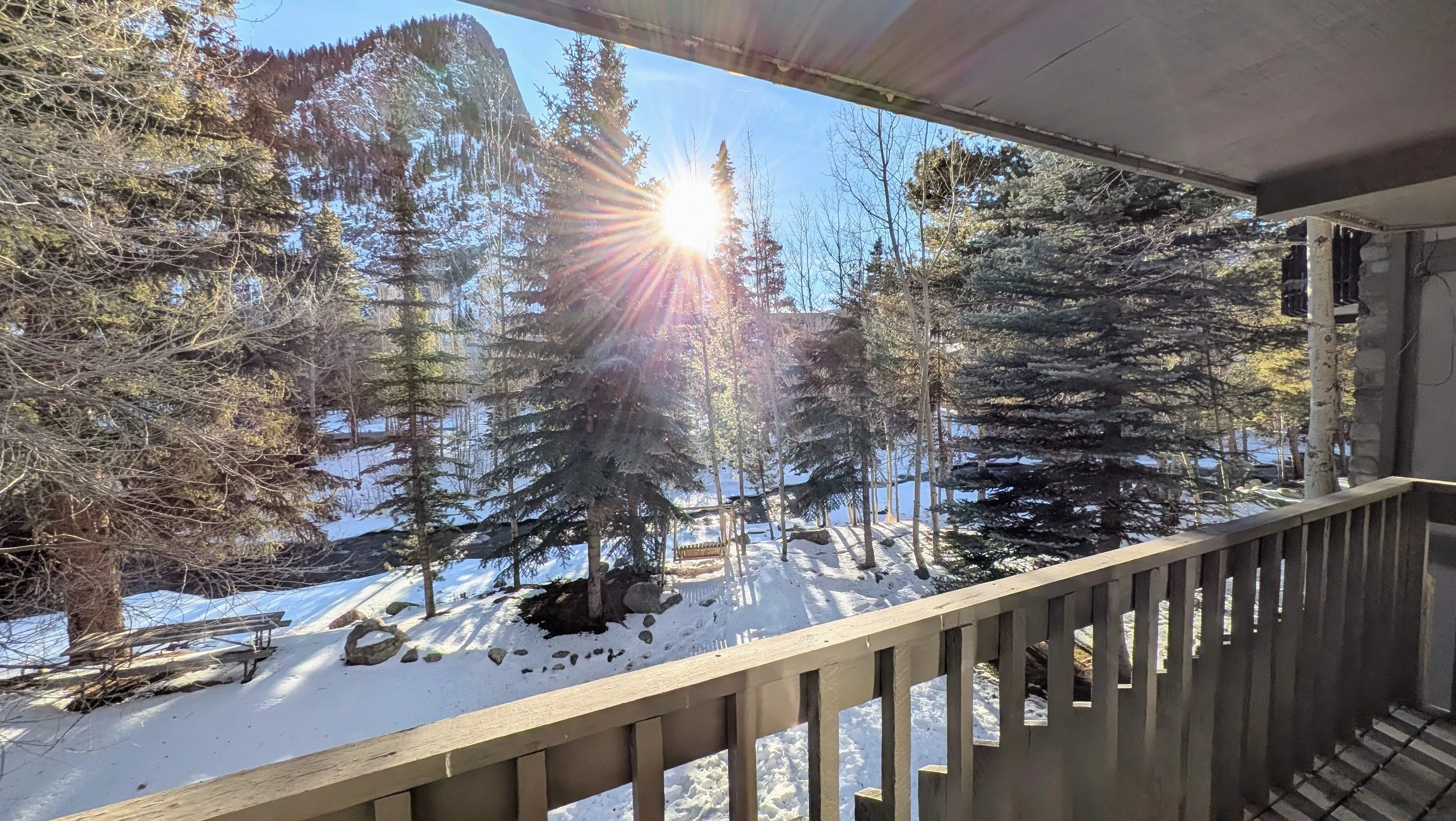 Primary bedroom deck overlooking Ten-Mile Creek