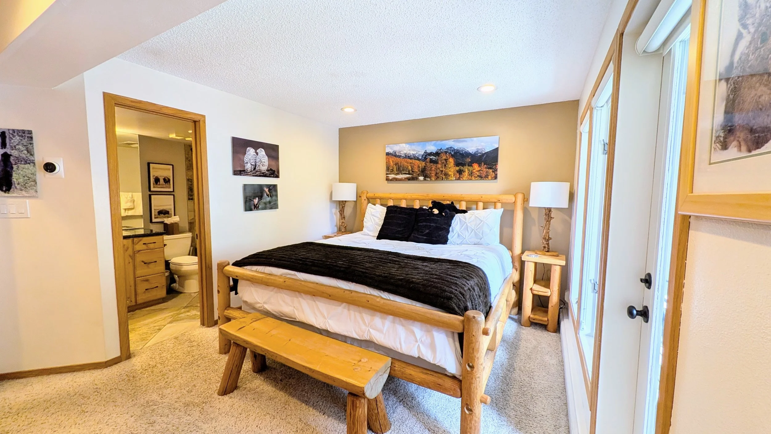 Primary bedroom with deck and gorgeous view of Ten Mile Creek