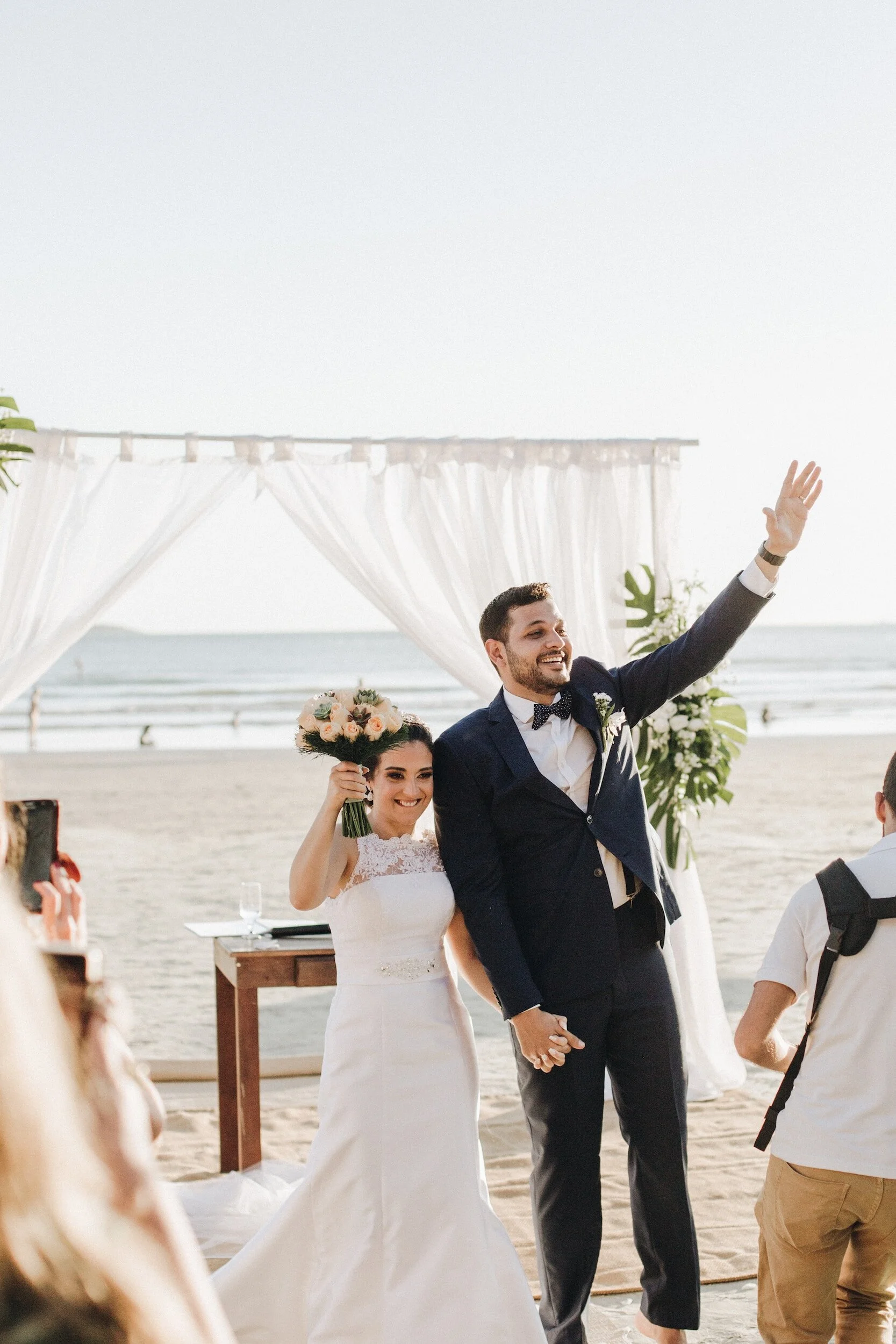happy couple just married on the beach