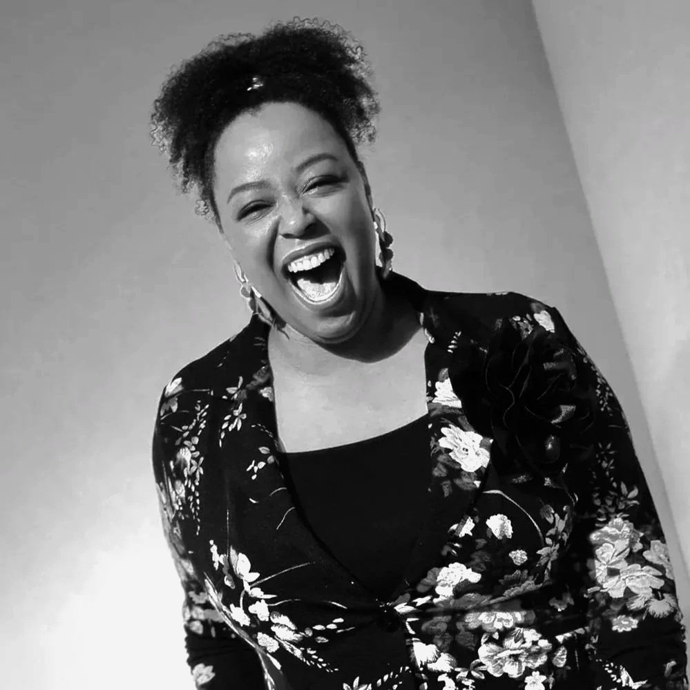 Black and white headshot photo of voice actor Lauren-Michelle Smith