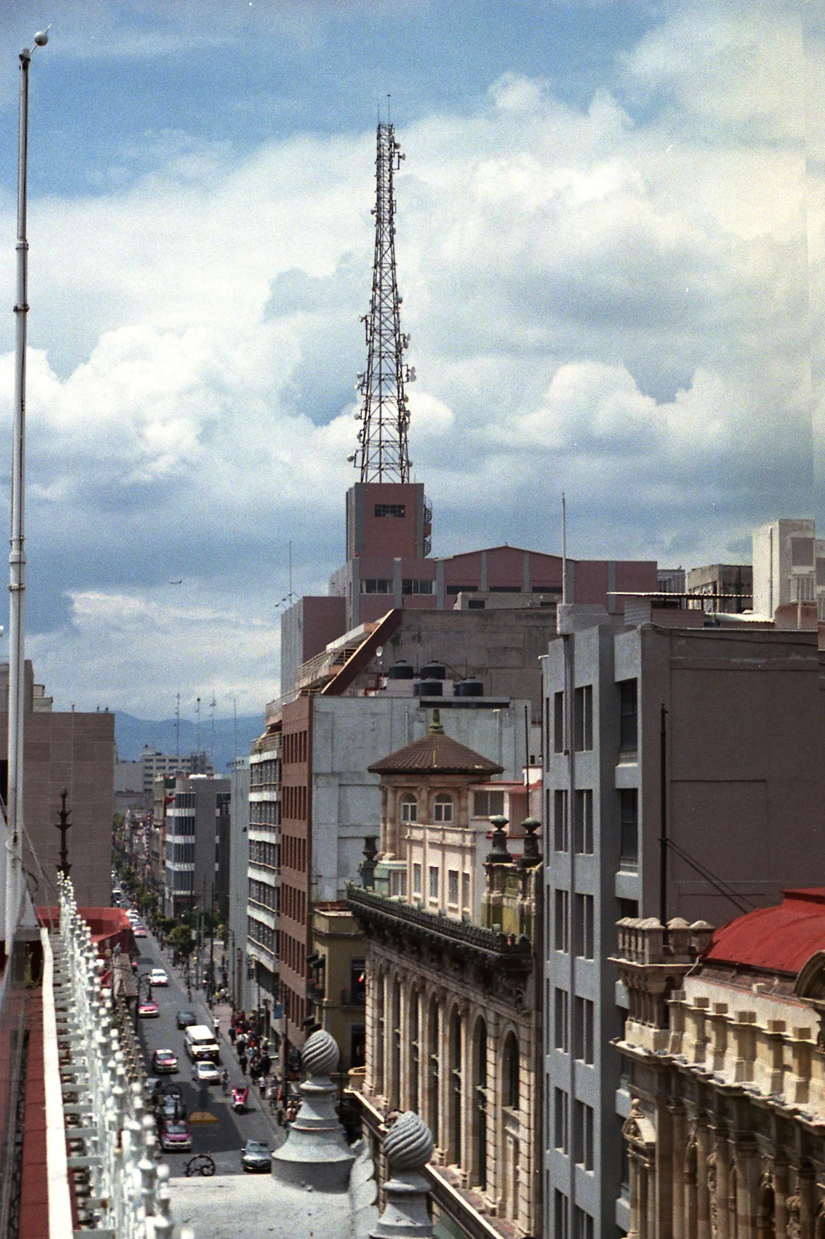 Color photo of buildings and an antenna on roof