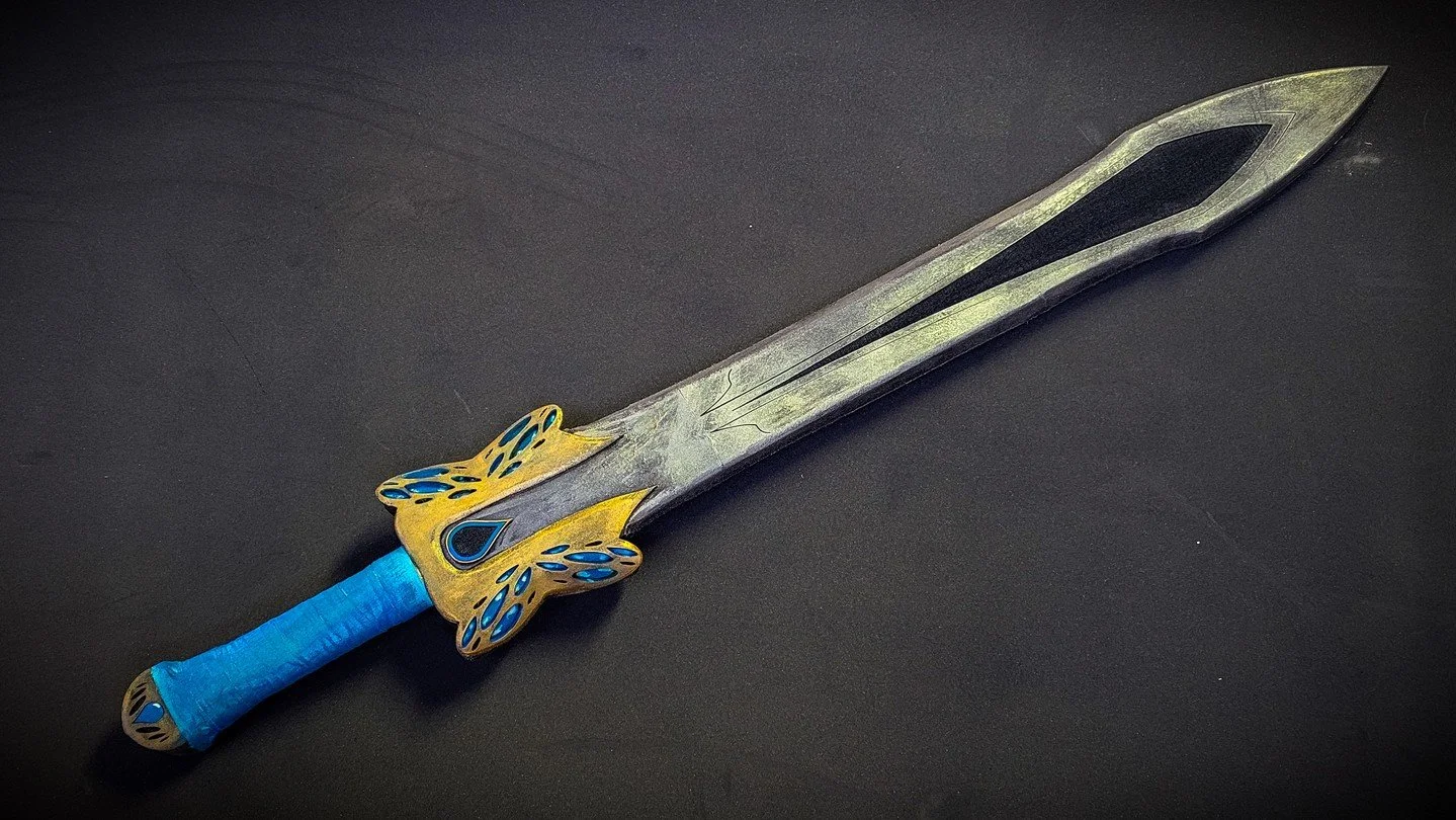 Never underestimate the fae, especially if they're on that butterfly fae-deal kind'a vibe. This prop saw several venues of LARP events in California and was a blast to make. Vibrant color and unique hilt design really got this thing together!

#LARPP