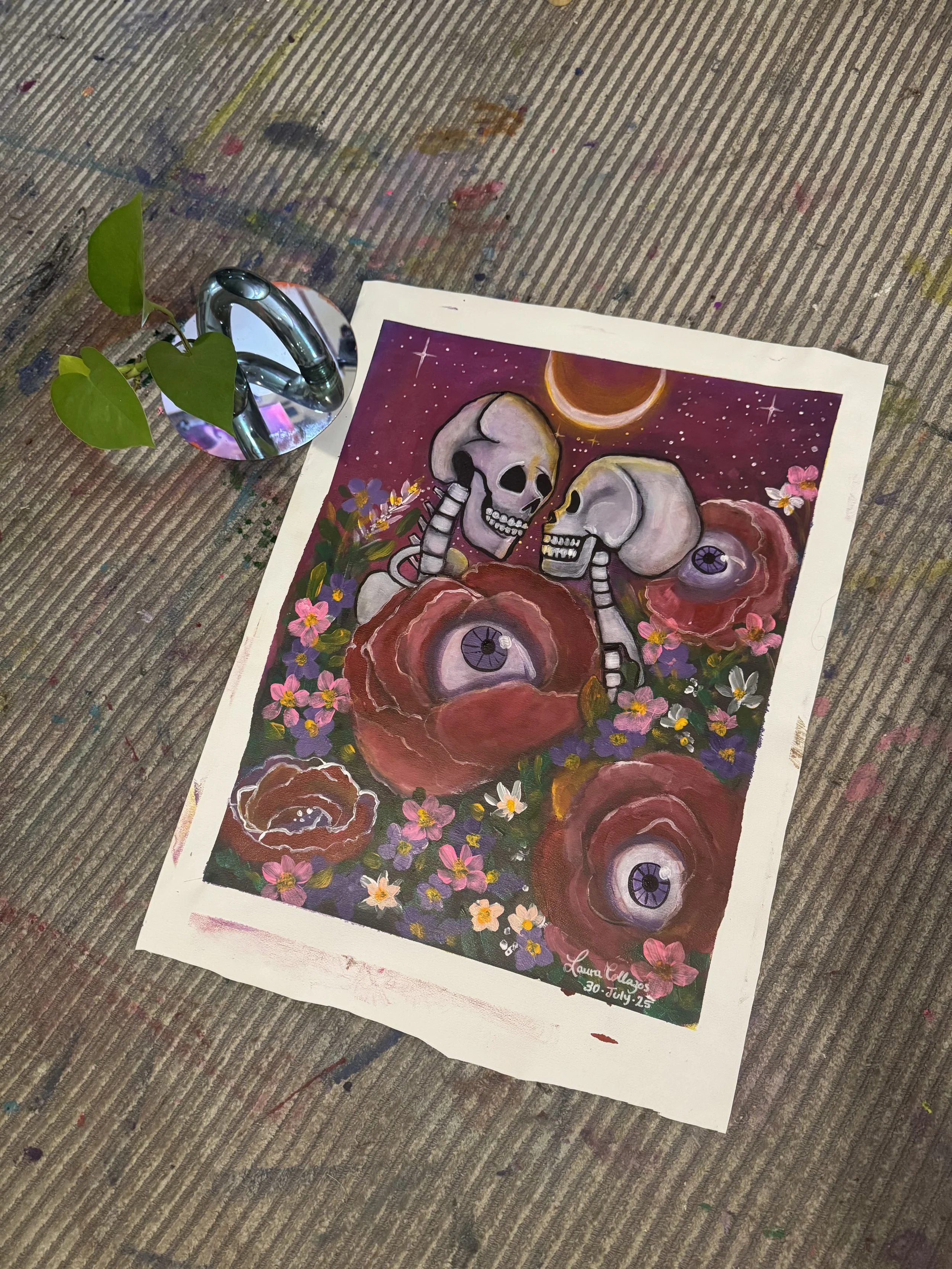 An art print featuring two skulls with mechanical joints, surrounded by large flower-like eyes and assorted smaller flowers, with a cosmic background including a crescent moon and stars.