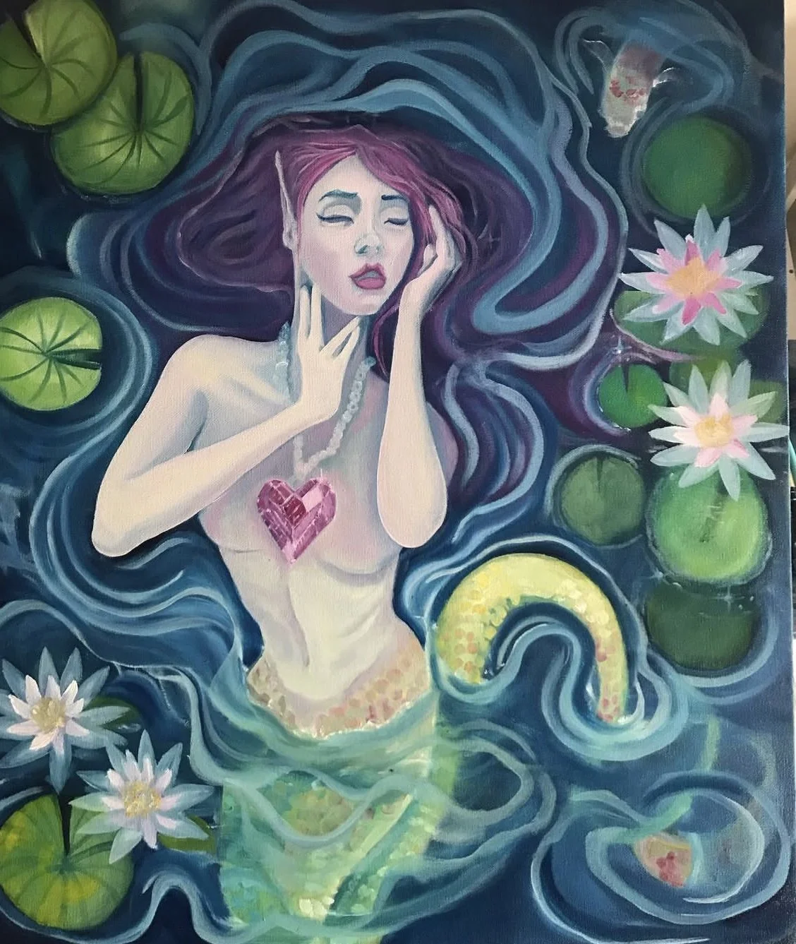 A fantasy painting of a mermaid with long purple hair, closed eyes, and a pink gemstone heart on her chest, surrounded by green lily pads, white water lilies, and swirling blue water.