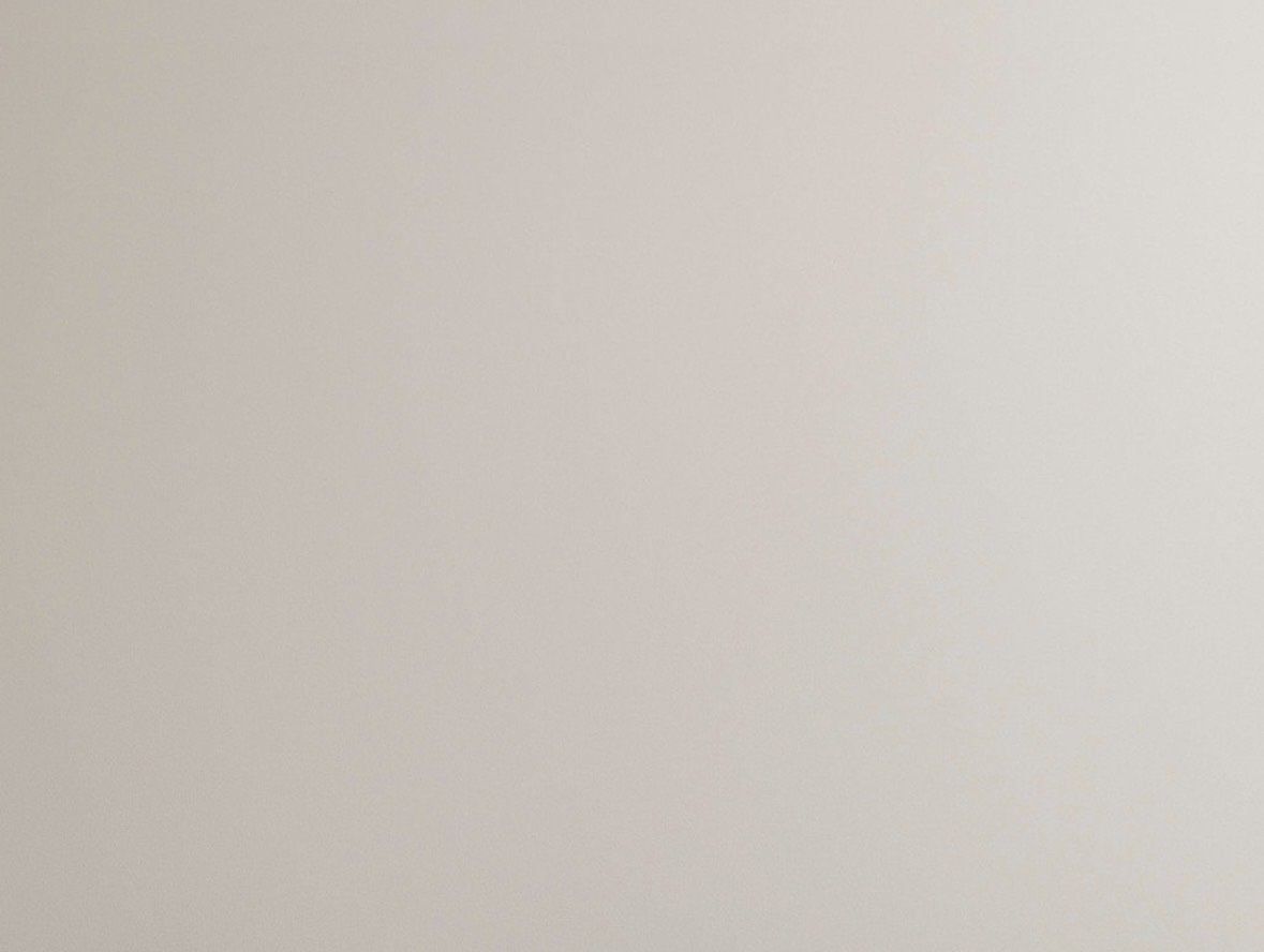 A plain white or off-white wall.