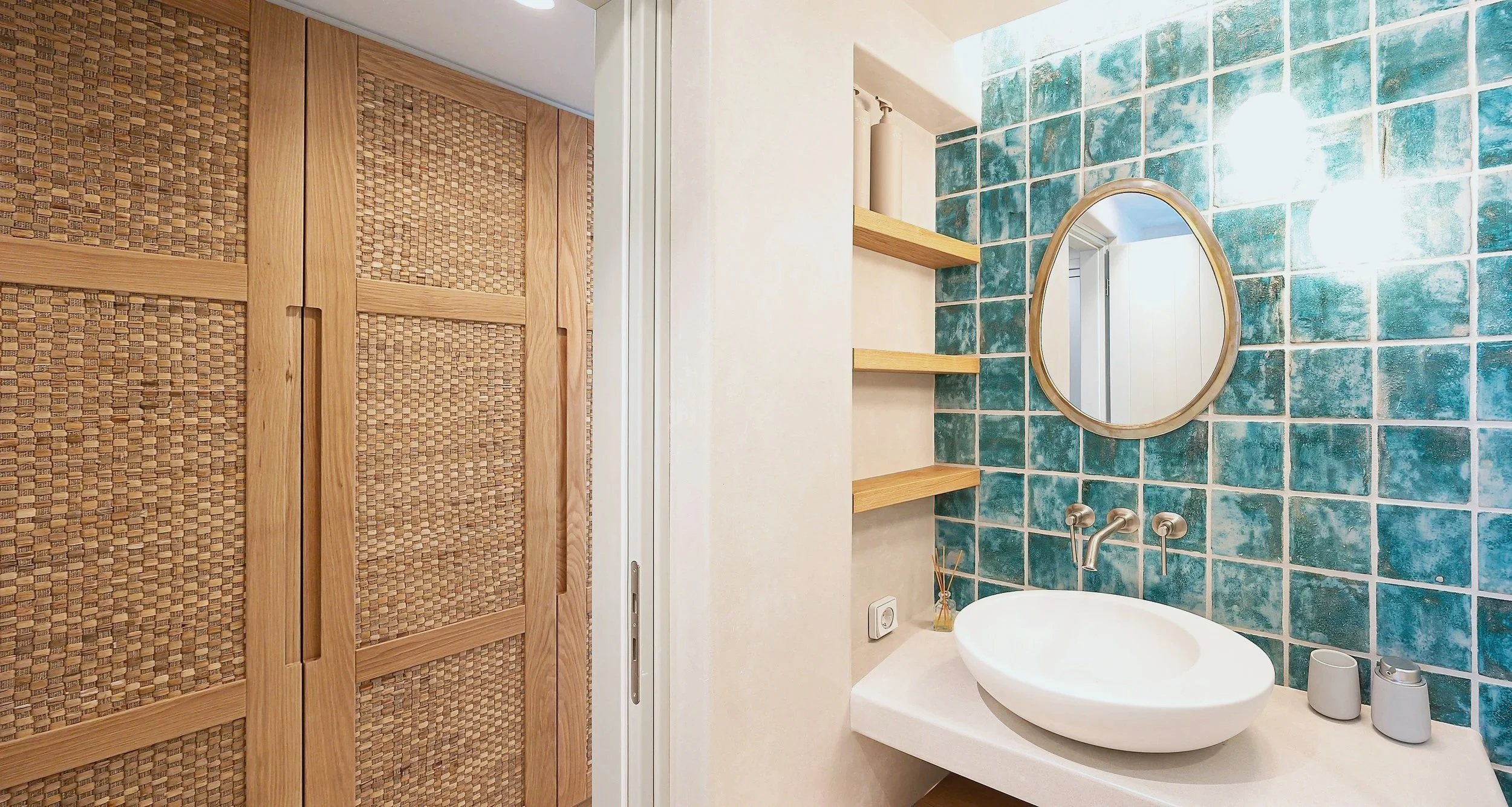Prokopios Beach House master bedroom bathroom with aqua blue tiles