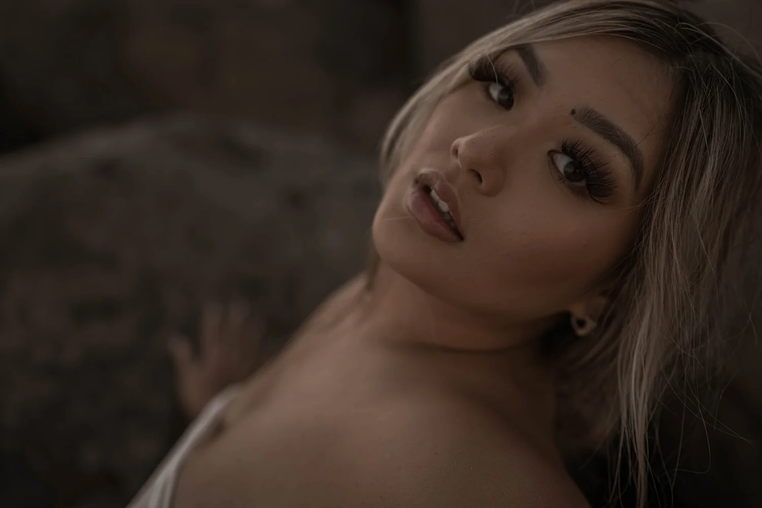 Close-up boudoir portrait after professional glam