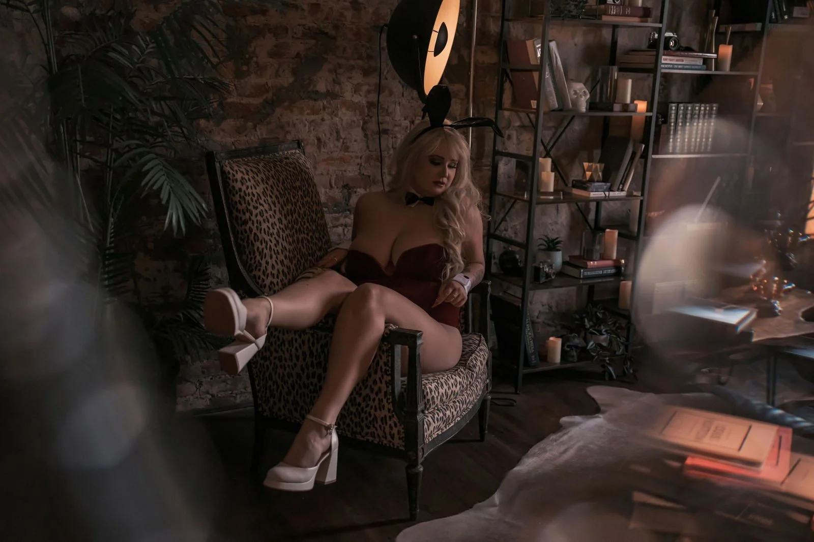 Woman in a bunny costume and white heels lounging in a vintage room, Playboy Bunny boudoir photos, Nashville