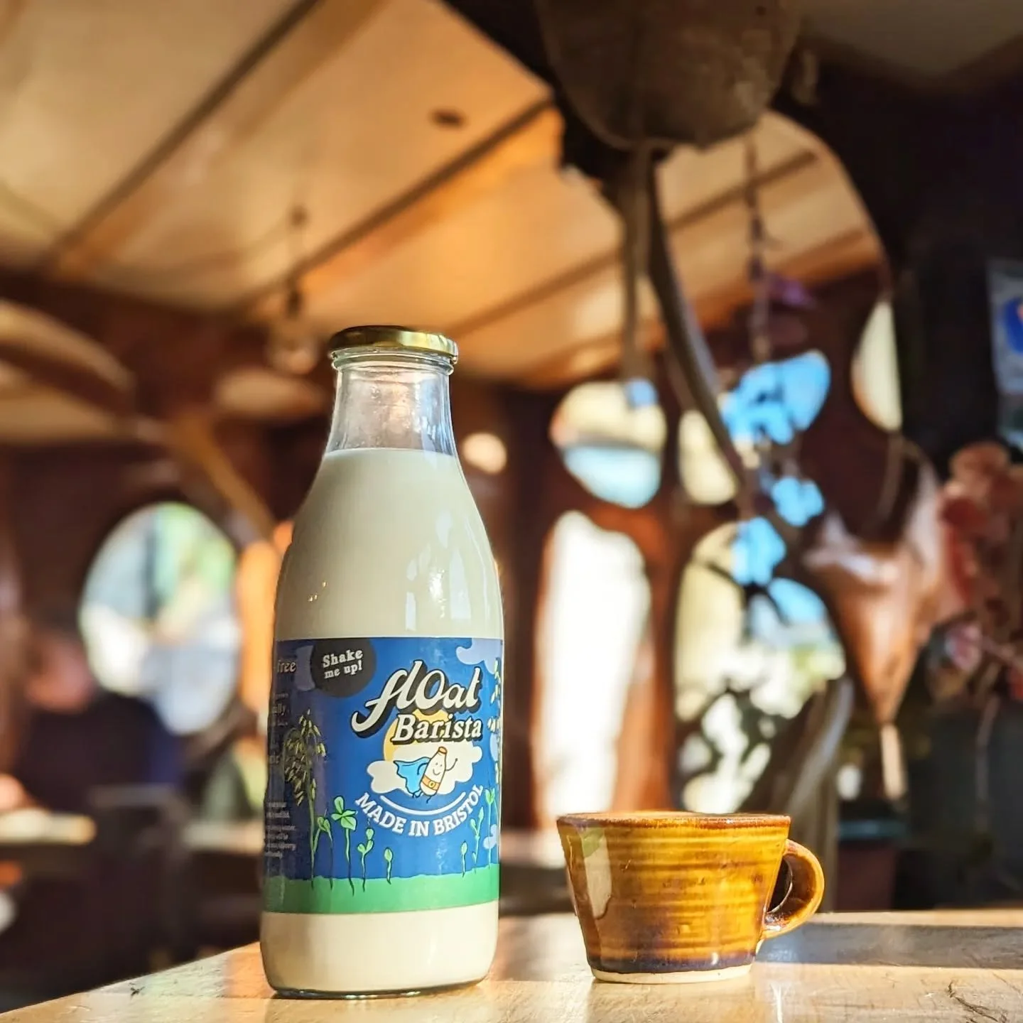 ...and on a sunny day, light pours in through the windows on the incredibly crafted gaudi-esque interior. Very cozy on rainy days too with the woodburner!