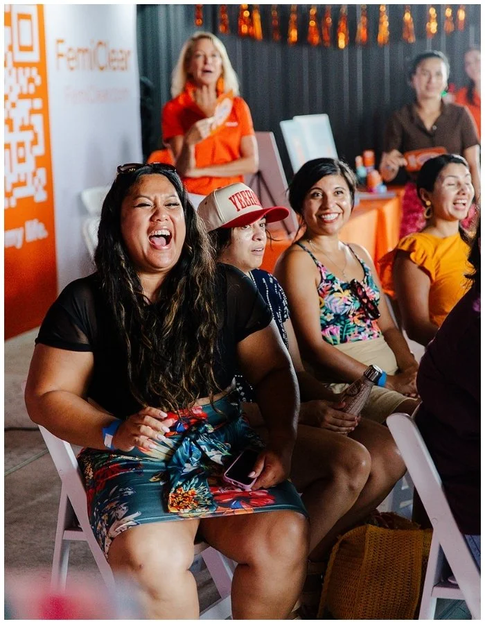 Attendees smiling at the YouMeShe Festival