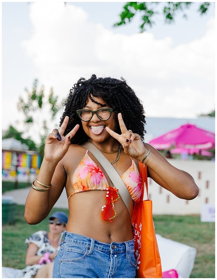 Smiling attendee of YouMeShe Festival 2025
