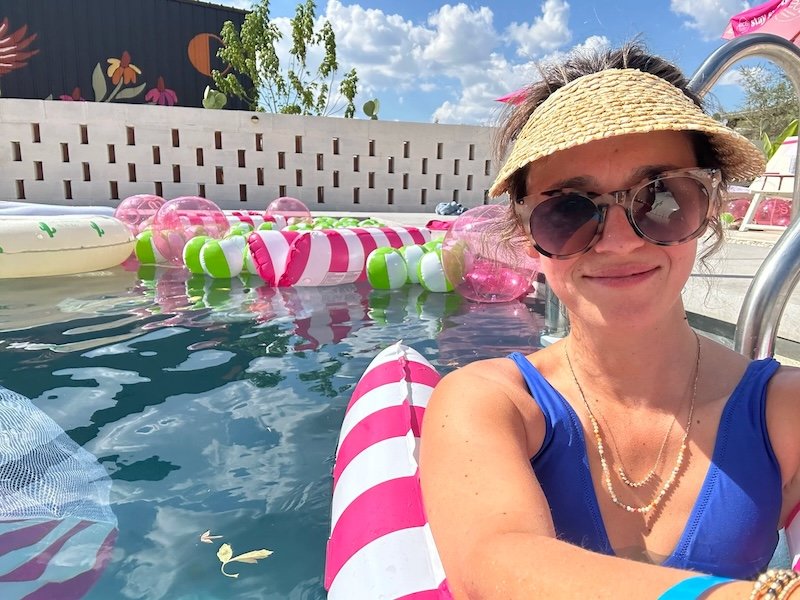 Woman enjoying pool party at Austin Texax YouMeShe Fest