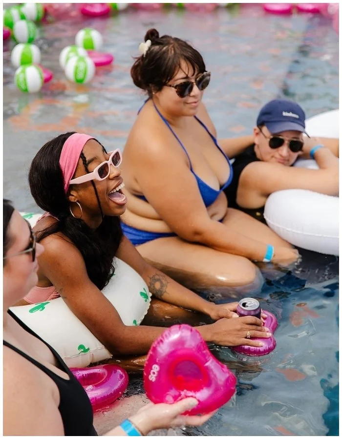 Women connecting at pool party at Austin Texas women’s festival