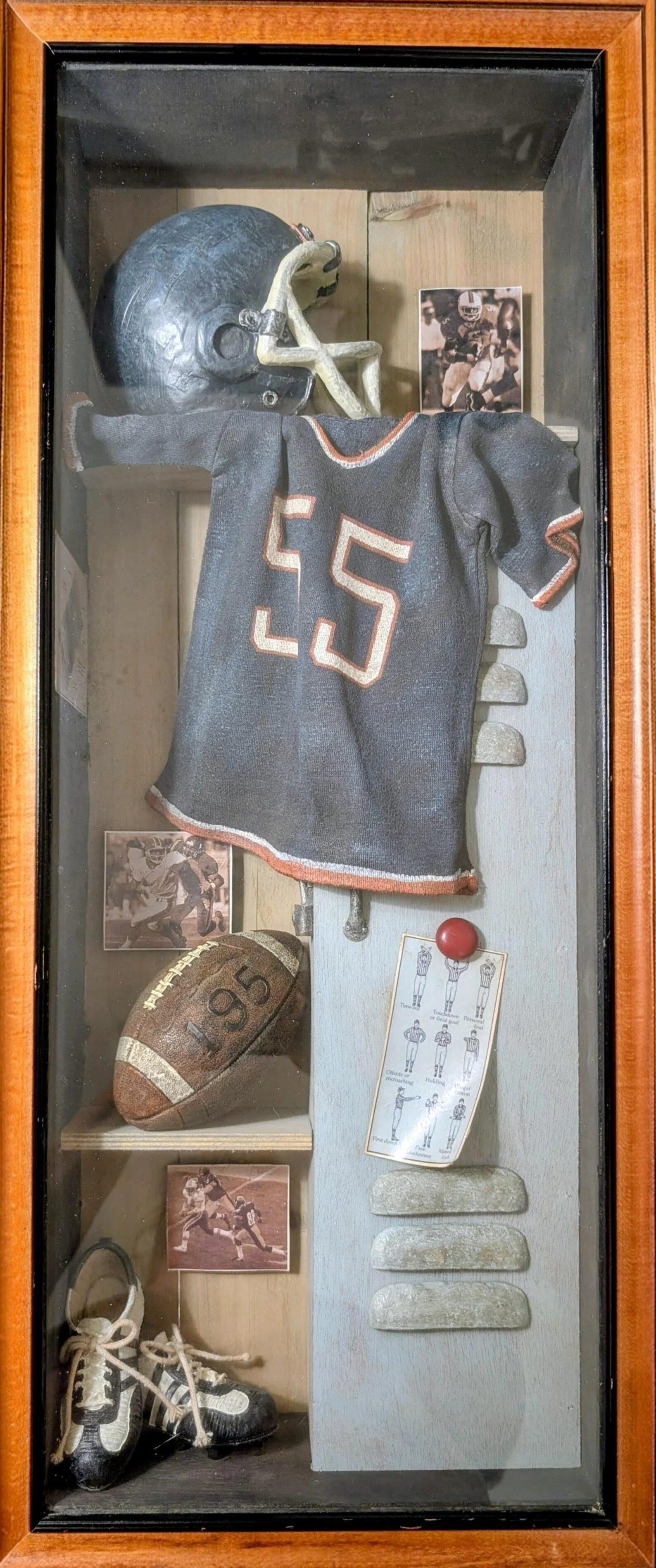 a sports memorabilia wooden football shadow box.