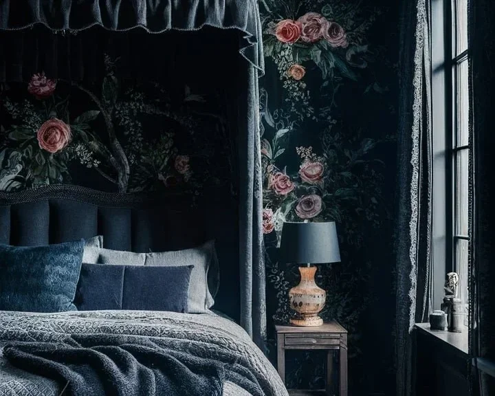 a dark cottagecore bedroom with floral wallpaper and black wood furniture.