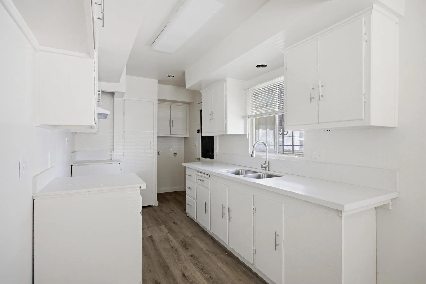 113-e-95th-st-front-unit-galley-kitchen-quartz.jpg