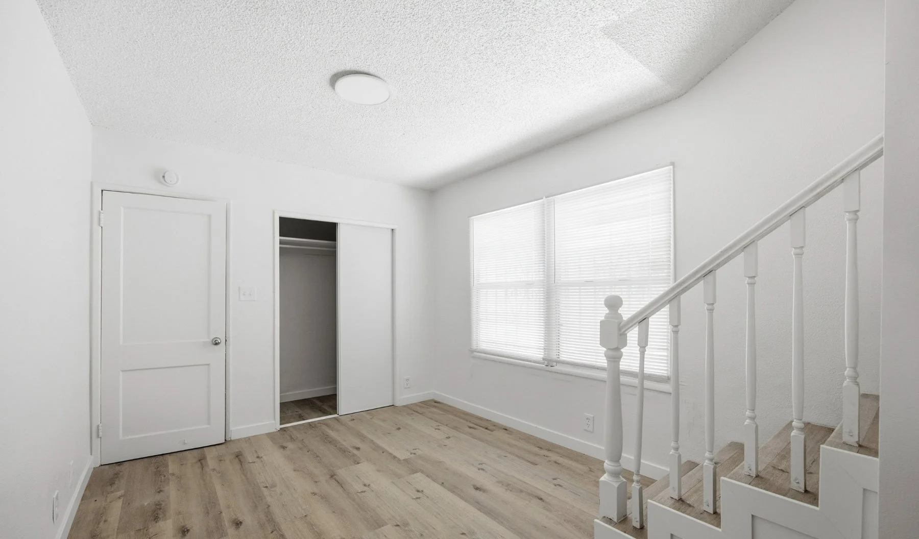 113-e-95th-st-two-story-master-suite-lower-level-stair.jpg