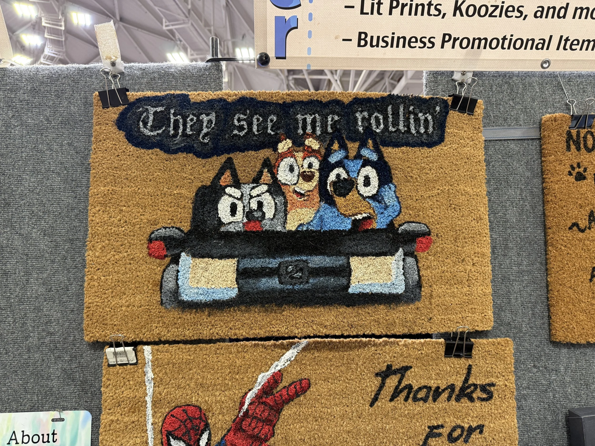 A doormat featuring cartoon dogs and the text 'Cherp see me rollin'.