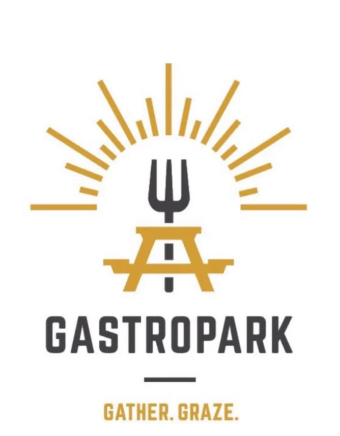 Logo with a stylized sunburst, fork, and picnic table, with the text 'GASTROPARK' and the tagline 'GATHER. GRAZE.'