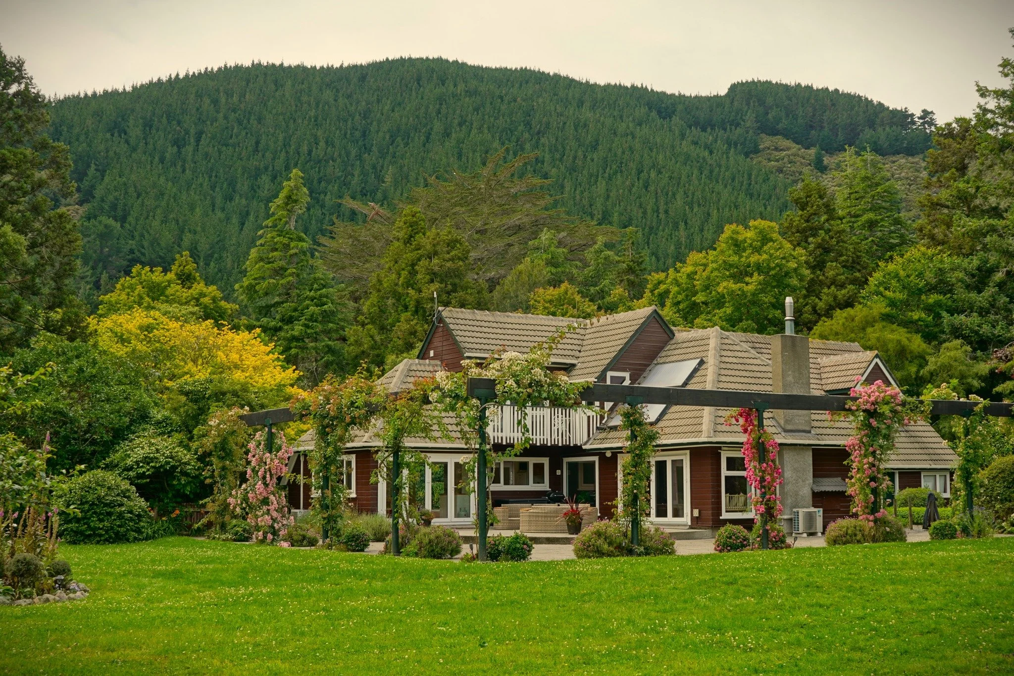 Woodcote ★★★★
A garden in transition in the best sense &mdash; formal bones, mature trees and heritage plantings, with natives and edibles being worked carefully through the framework. Part of Mangaroa Farms in Whitemans Valley, Upper Hutt, and shape