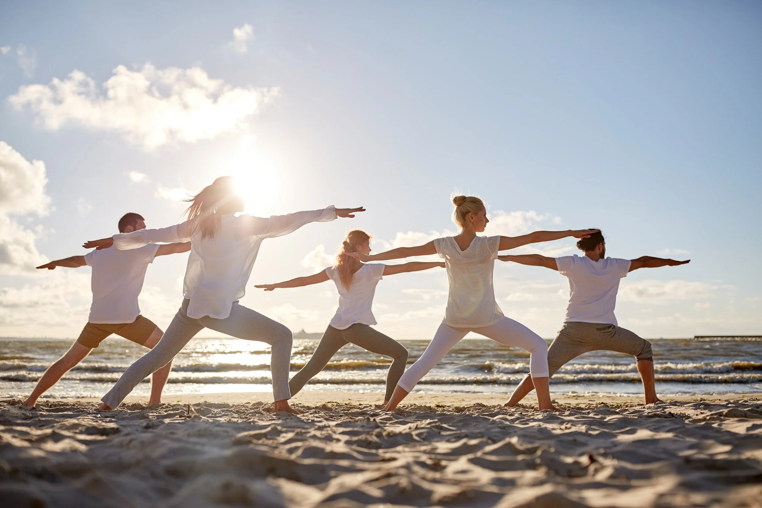 GroupBeachYoga_Shutterstock - 3.jpg