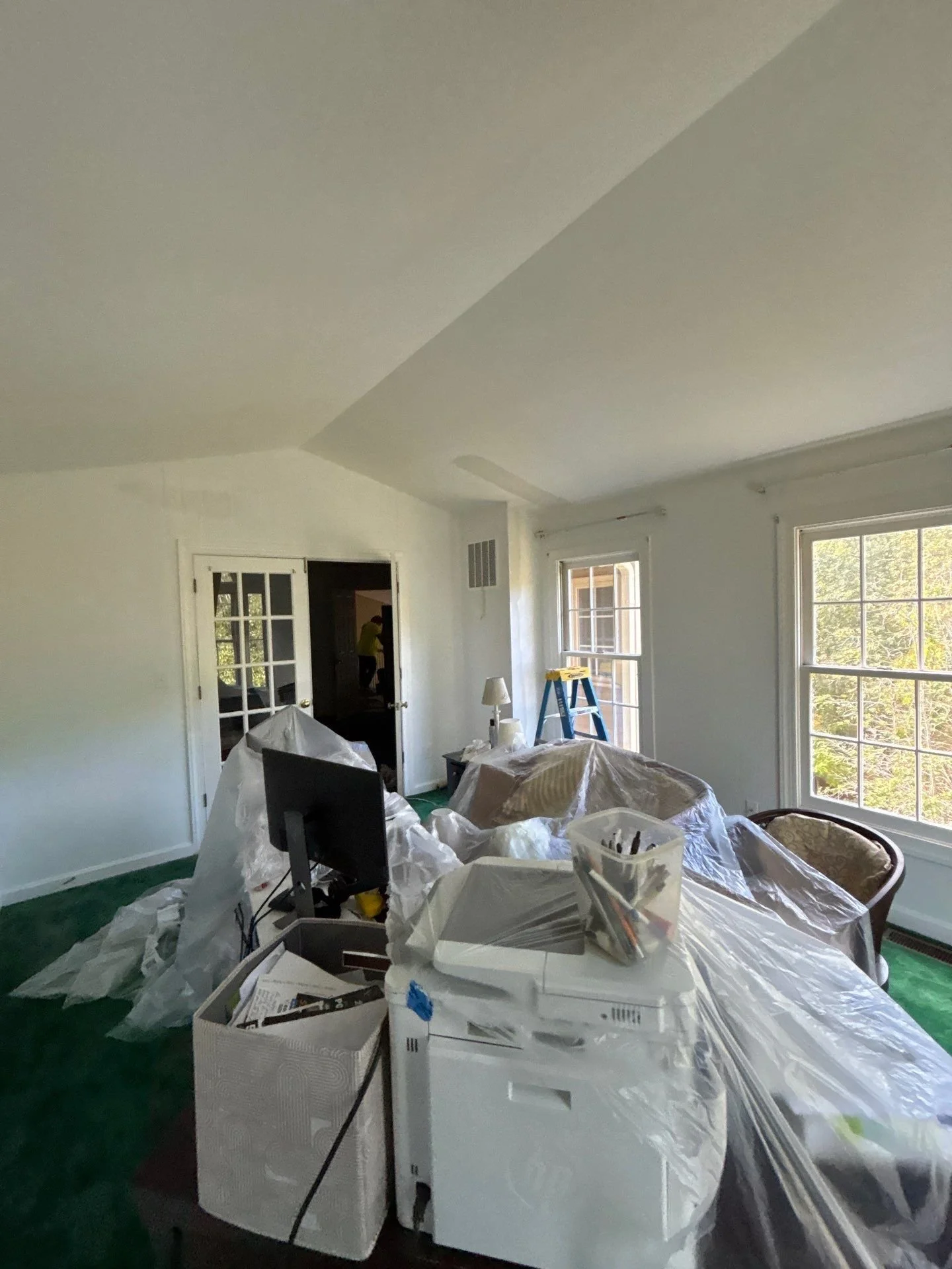 Professional interior painting project completed in Dumfries, Virginia. Office room painted using Sherwin Williams white paint. Work included drywall crack repairs, tape and mud application, sanding, full surface prep, moving contents, and protecting