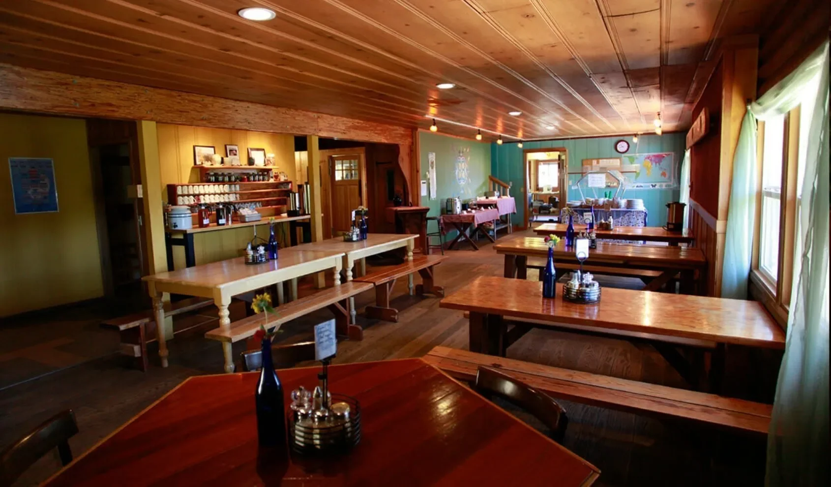 Rustic dining lodge at Heartwood Mountain Sanctuary where guests share nourishing meals during a women’s wellness retreat in Southern Humboldt County, California.