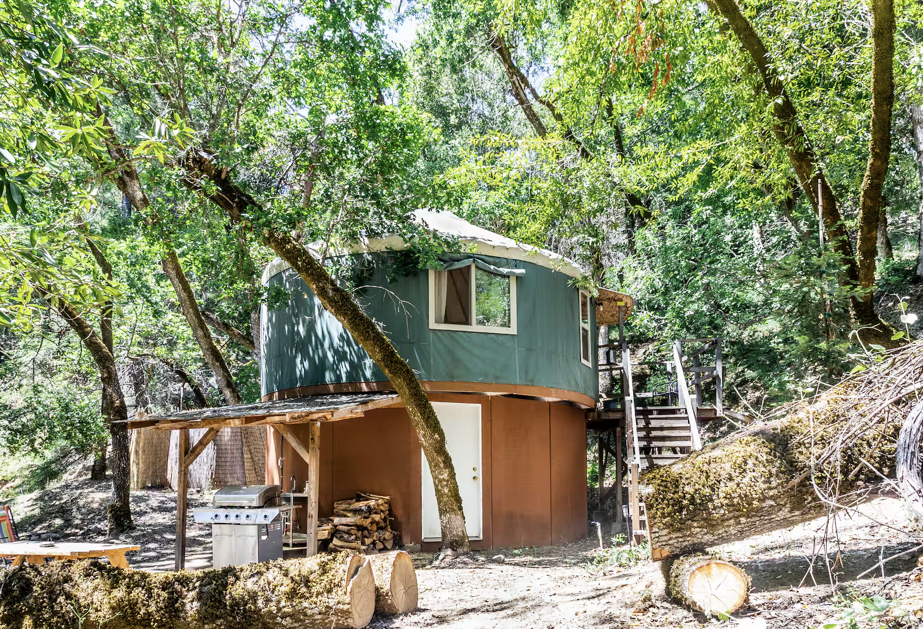 The Earthen Yurt ~ (SOLD OUT) Drift into dreams beneath the captivating Tree of Life headboard, surrounded by lunar cycles adorning the interior walls.