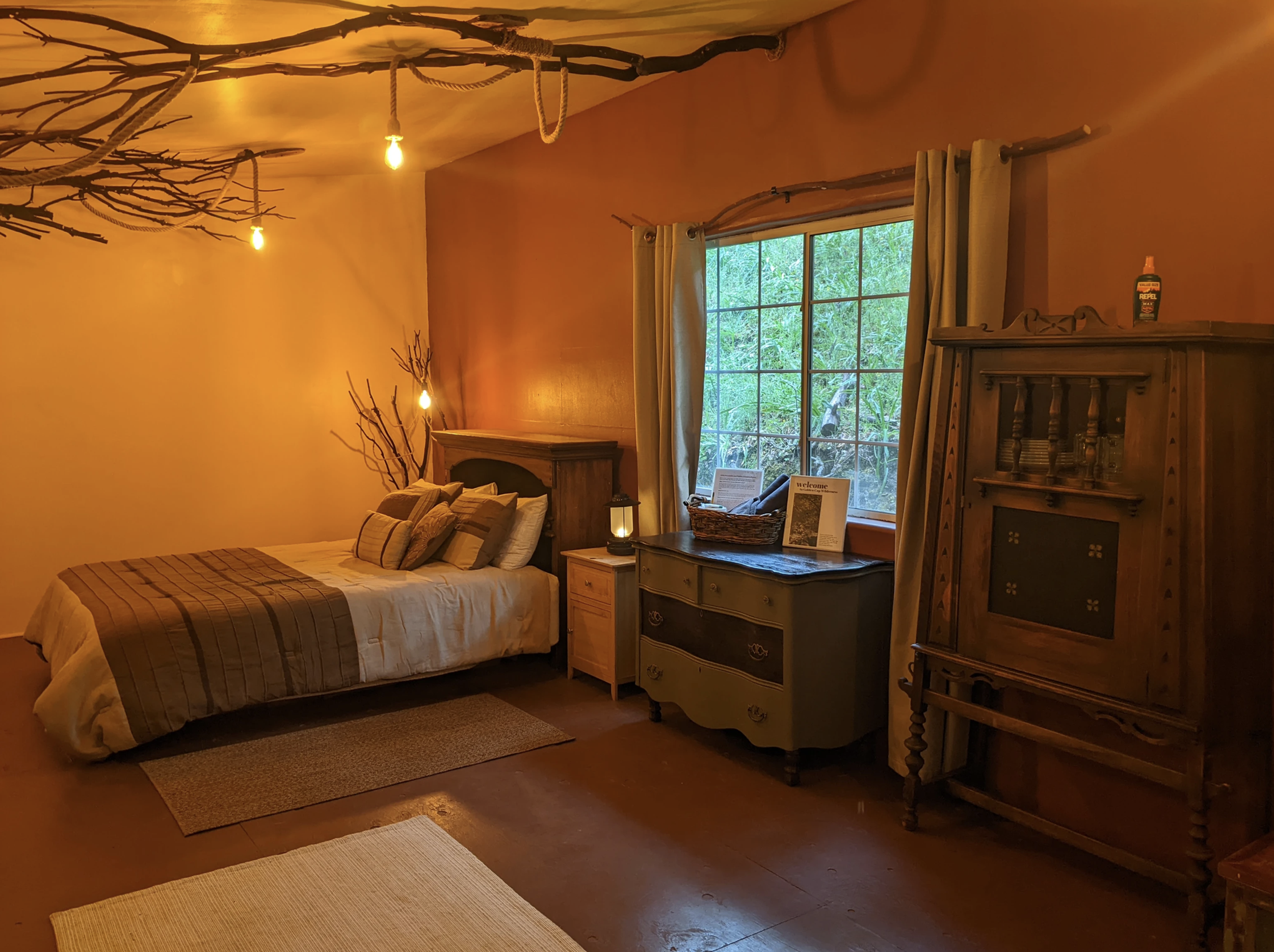 The Cabaña ~ This rustic retreat, once a charming farm building, now awaits you with antique Basque furnishings and rustic charm. Let the symphony of wildlife and the gentle flow of the creek lull you into serenity. 