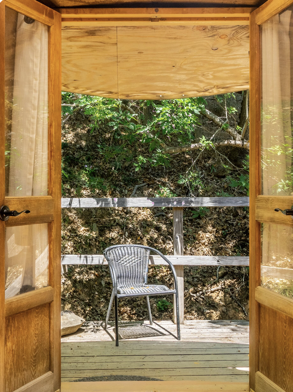 The Earthen Yurt ~ Drift into dreams beneath the captivating Tree of Life headboard, surrounded by lunar cycles adorning the interior walls.