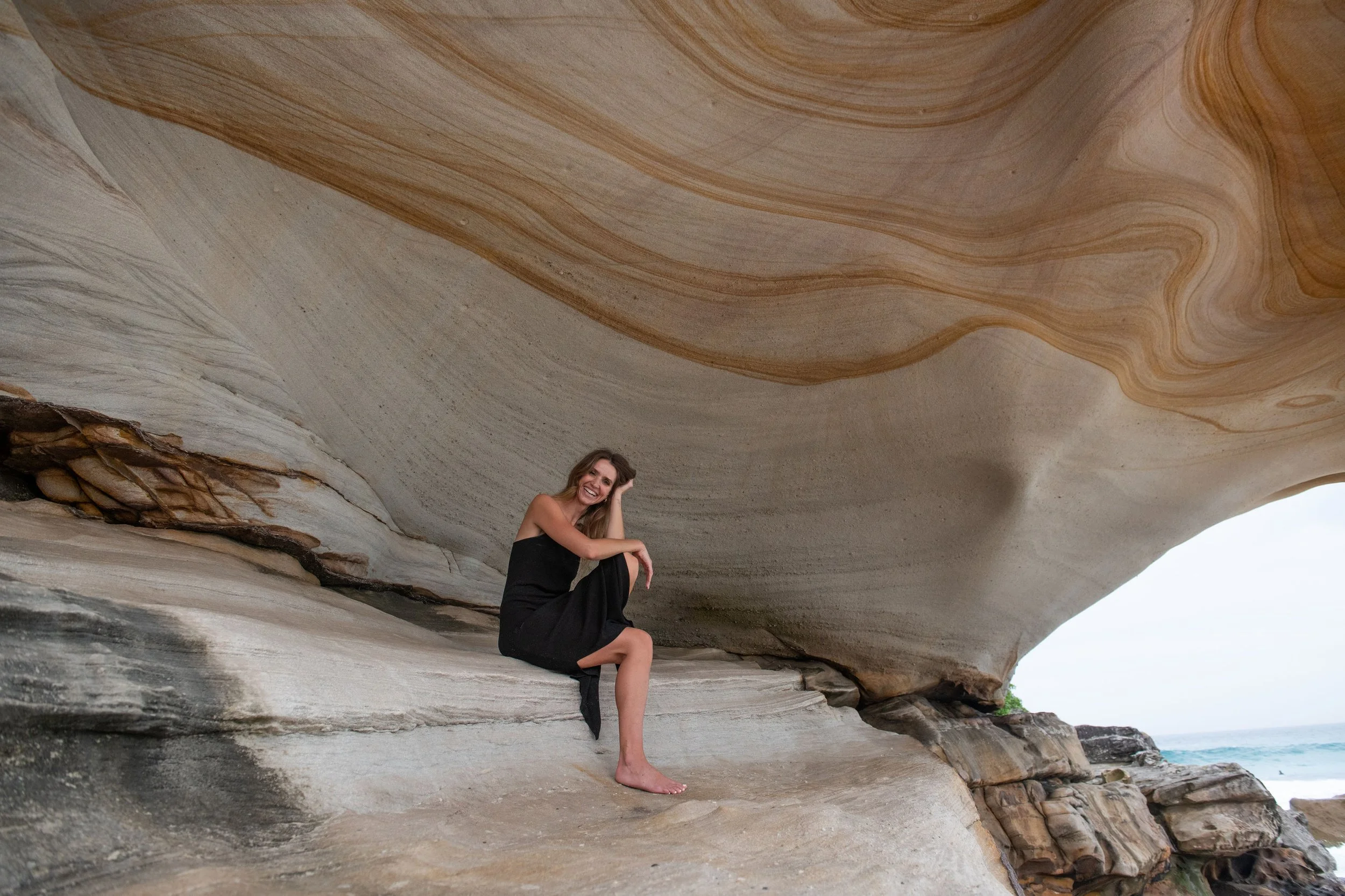 Jessica Barker smiling confidently, representing authentic leadership and feminine strategy