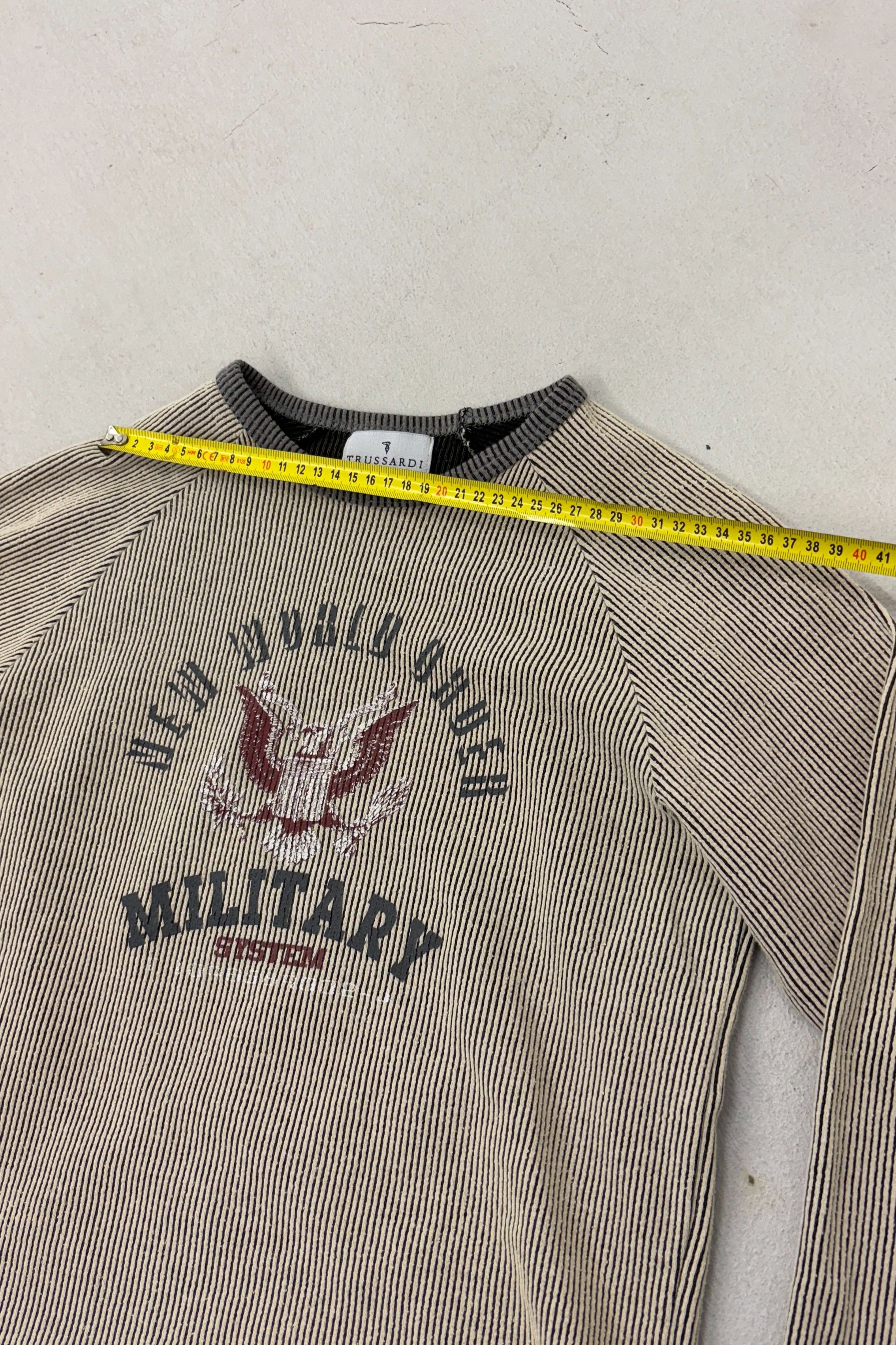 A flat lay of a Trussardi long-sleeve T-shirt showcasing its unique vintage print and soft fabric.