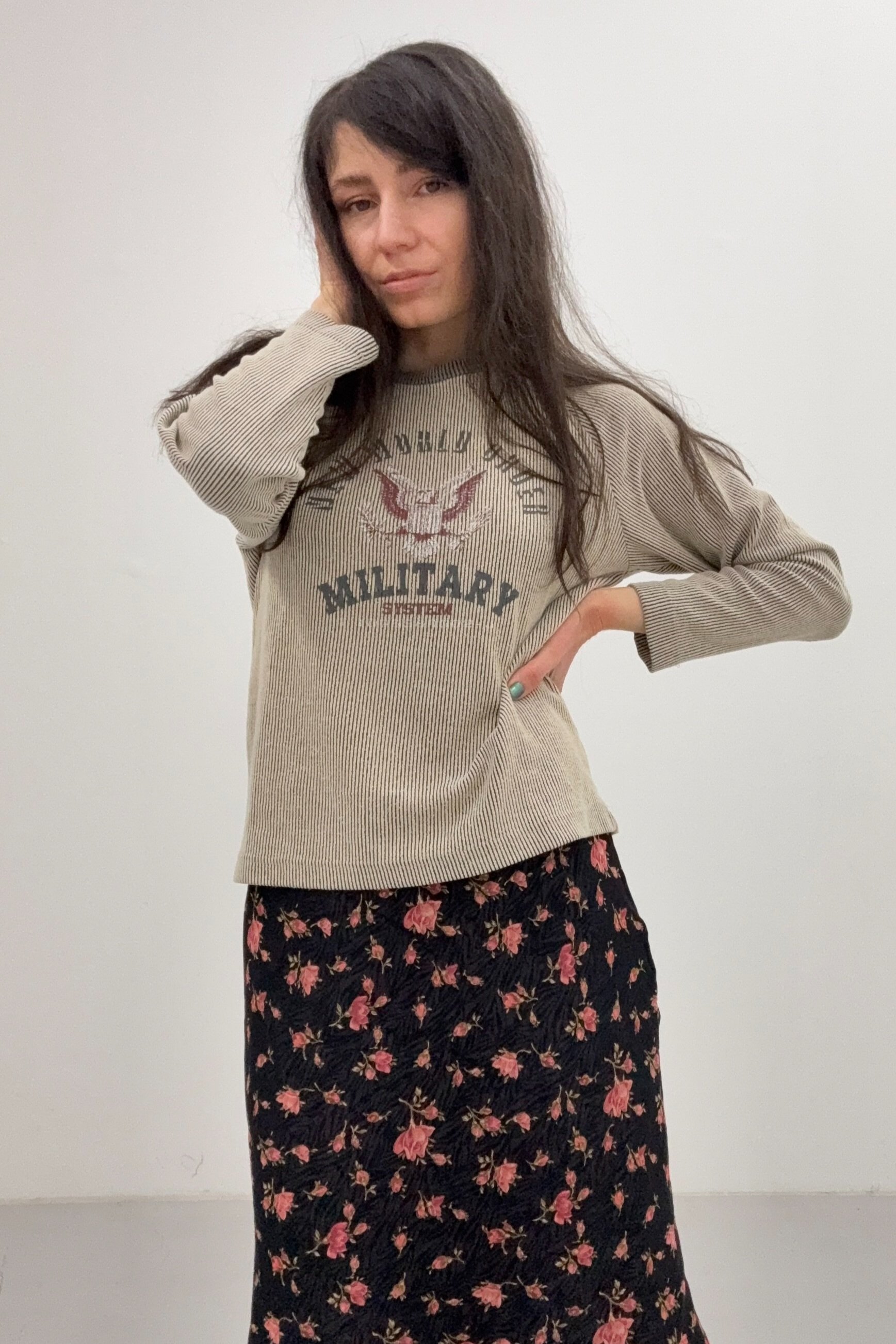 A model wearing a Trussardi long-sleeve T-shirt with a stylish, faded vintage print.
