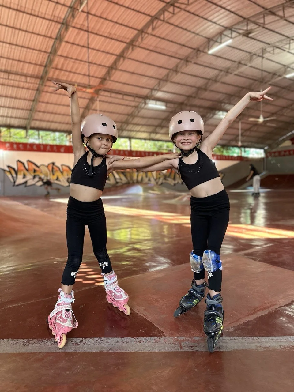 Children rollerblading at K2 Skate Park on Bamboo Street, Siem Reap. Affordable $2 USD skate rentals available.