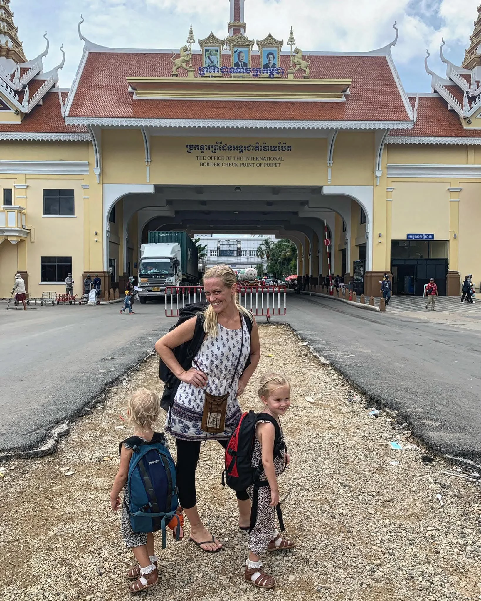 Babel Guesthouse owner backpacking through Southeast Asia with her two young daughters at the Poipet border crossing between Cambodia and Thailand