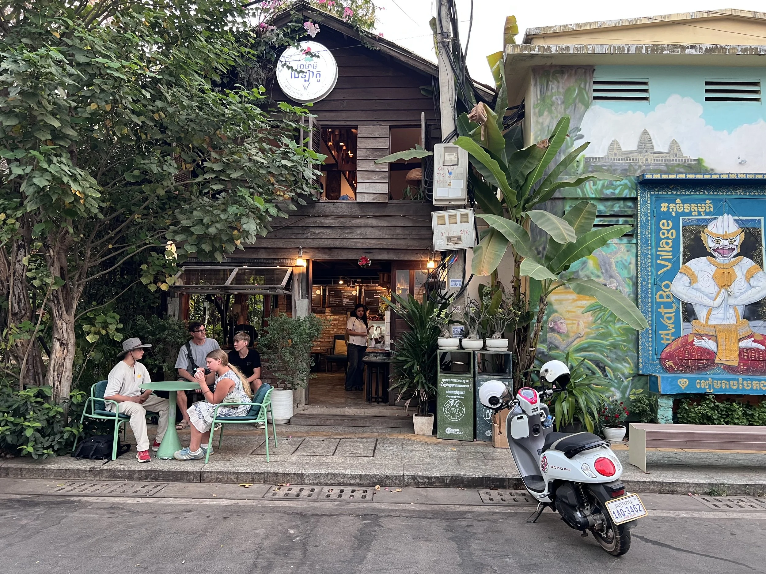 Street 26 in the Wat Bo area of Siem Reap, featuring Footprint Cafe, Banlle garden restaurant, and street food.