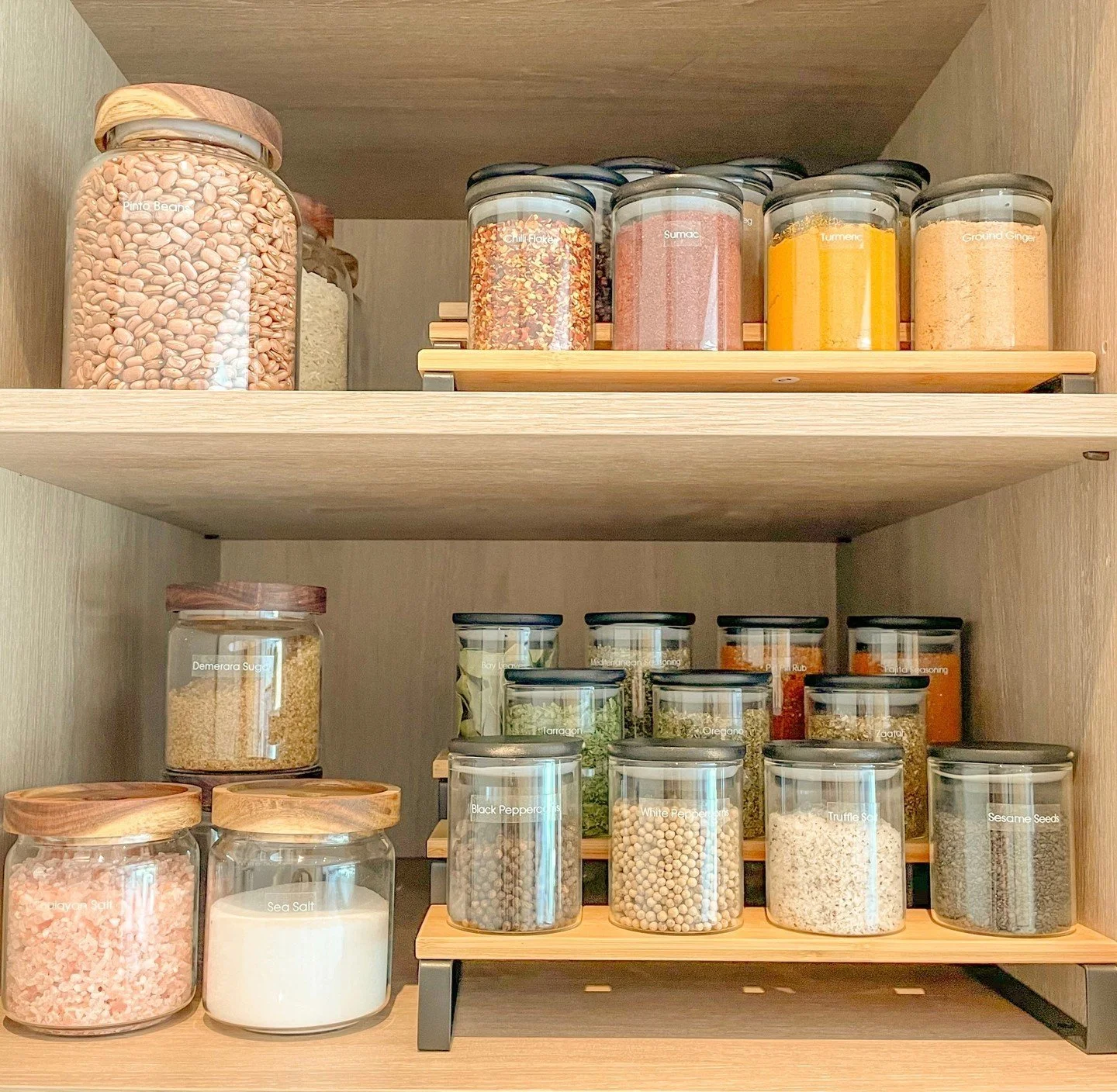 This combination of decanting and shelf risers means that every ingredient in this small kitchen cupboard is easily accessible! 

Don&rsquo;t you agree it looks fab too 😍