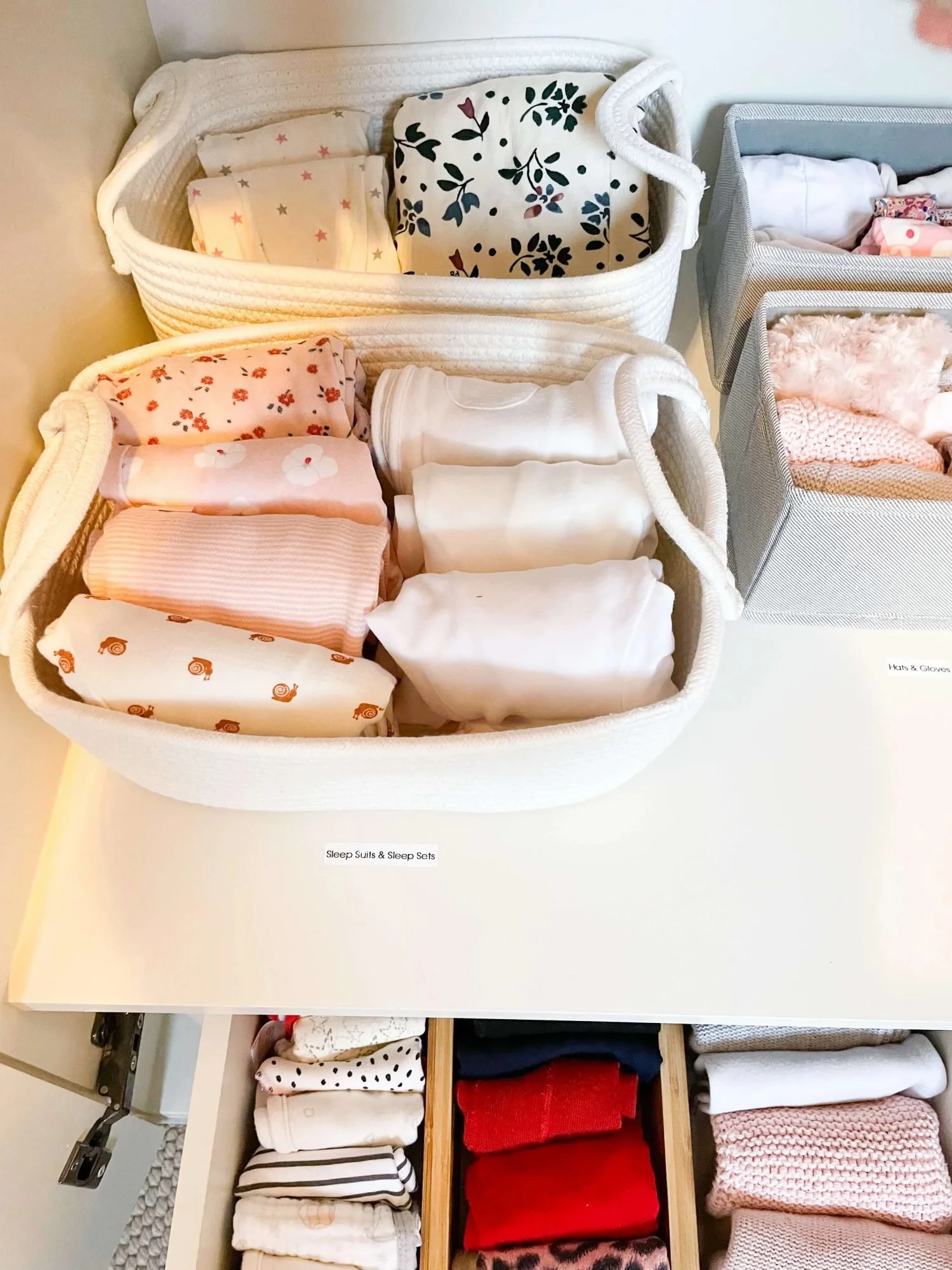 neatly organised baby clothes