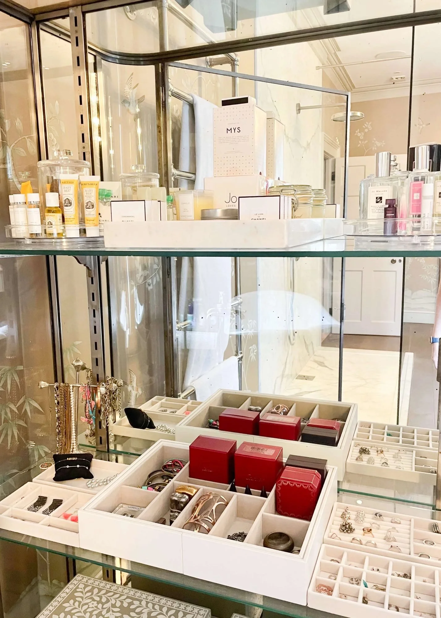 A jewellery and fragrance station designed with glass