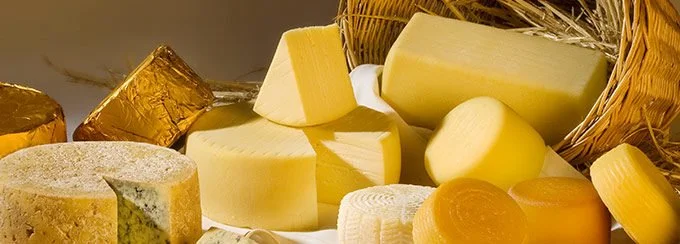 Cheese varieties falling out of wicker basket