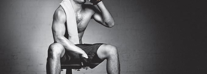 Man drinking chocolate milk after workout