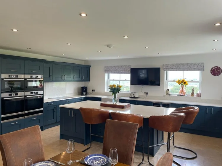 Foxhall Farm kitchen with dark cabinetry and central island