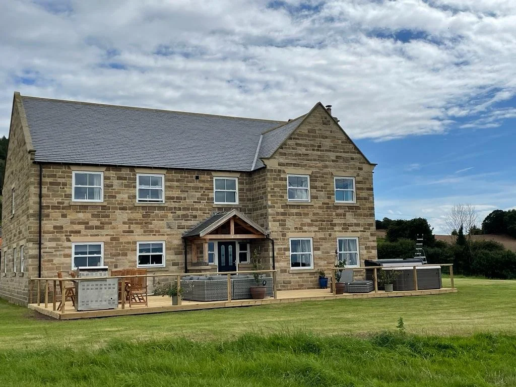 Stone farmhouse and outdoor decking at Foxhall Farm