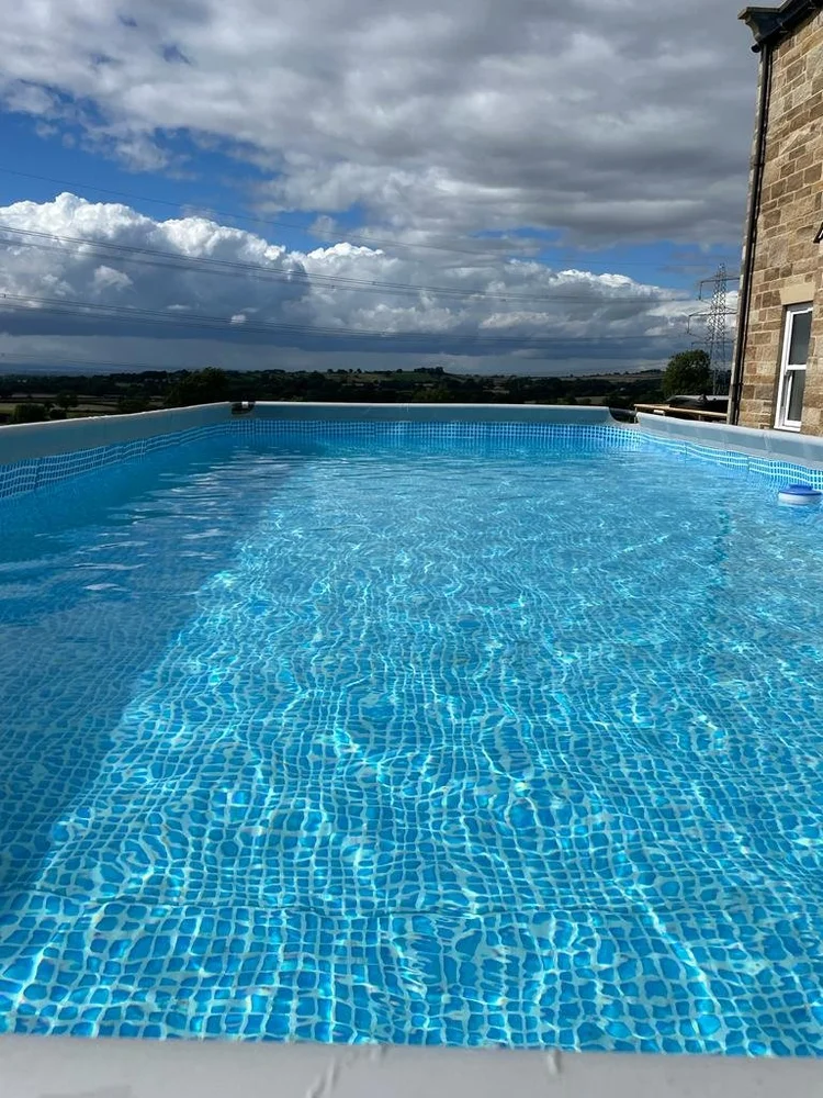 Foxhall Farm outdoor swimming pool with countryside views