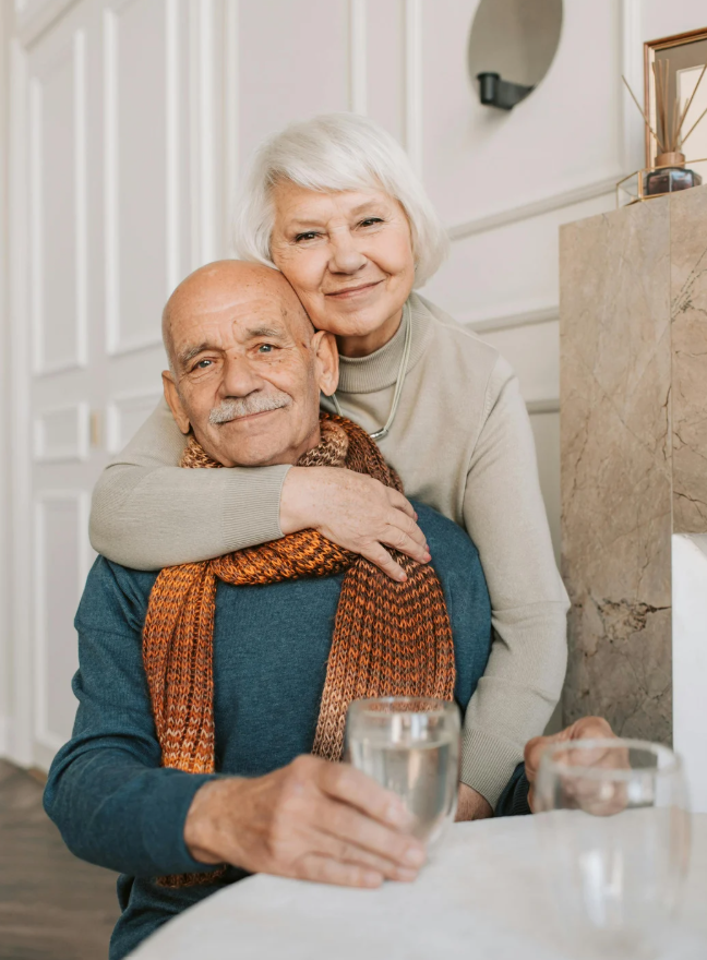 Elderly couple hugging