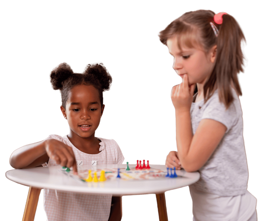 Two happy girls playing a board game