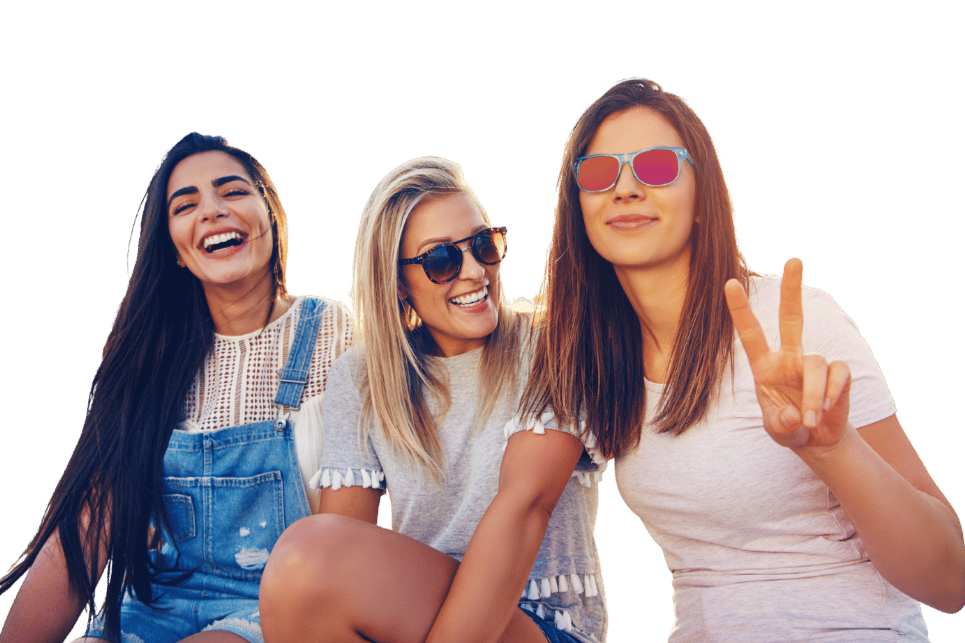Three smiling women with peace sign