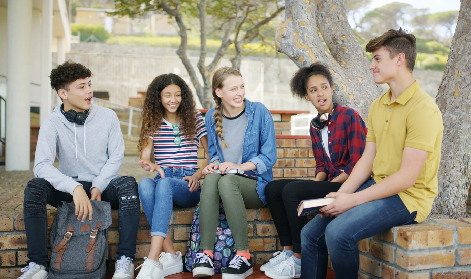 Teens laughing at a friend