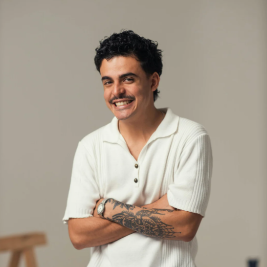 Adult male with tattoos smiling
